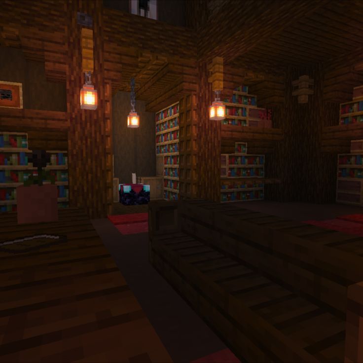 a dimly lit room with several bookshelves and lights in the ceiling is shown