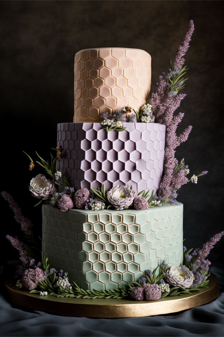 Wedding cake inspired by honeybees. Lavender flowers on the sides, with a honeycomb texture wrapped around the tiers. Honeybee Wedding, Honeycomb Wedding Cake, Lavender And Honey Wedding, Honeycomb Wedding Decor, Hexagon Wedding Cake Topper, Bee Wedding Theme, Bee Wedding Cake Topper, Hexagon Wedding Cake, Bee Wedding Cake