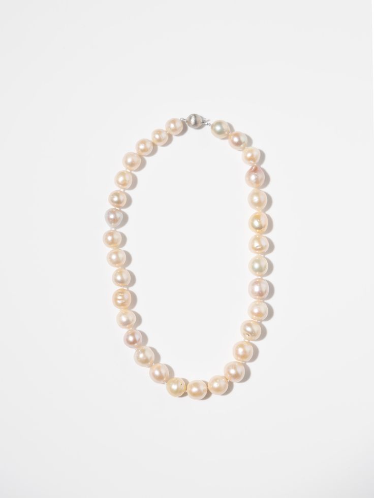 Add a touch of sophisticated, timeless beauty to your wardrobe with our Pink Pearl Necklace. Elevate any outfit with this elegant piece! 18 inches long Freshwater Pearls Elegant 16 Inch Pearl Necklace Gift, Elegant 16-inch Pearl Necklace Gift, Elegant 16 Inch Round Pearl Necklace, Formal Necklaces With Round High Luster Beads, Formal High Luster Round Bead Necklaces, Formal High Luster Round Beaded Necklaces, Pearl White High Luster Necklace For Anniversary, Elegant Necklace With High Luster Round Beads, Classic High Luster Necklaces For Anniversary