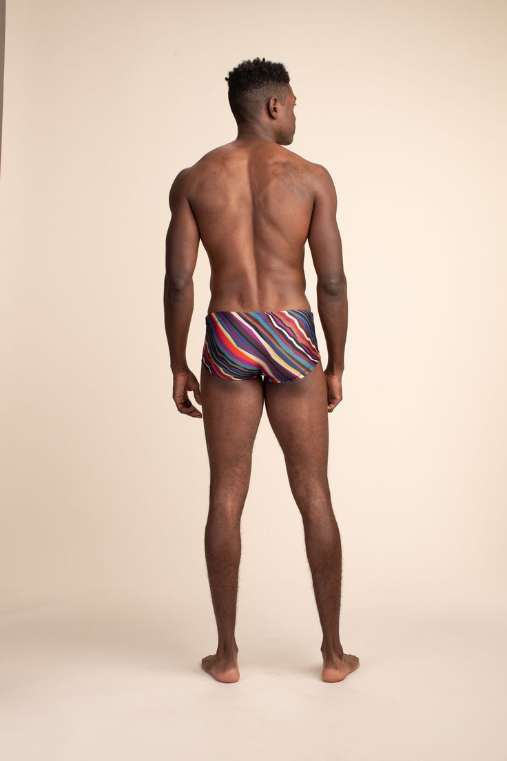 New! Mr. Turk South Beach Swim Trunk Ideal for your next vacation, this easy swim trunk features a colorful print, comfortable inner drawstring closure, and a fitted silhouette. A fierce new addition to your swim wardrobe, this men's swim short is ready for any adventure. Inner, adjustable drawstring Fitted Underseam: 3.75", Front rise: 8" Electric Reef Swim Print 83% Nylon, 17% Lycra Hand wash cold. Fabric from Portugal. Beachwear Swim Trunks For Water Polo, Beach Season Water Polo Swim Trunks, Fitted Multicolor Swim Trunks For Swimming, Multicolor Swim Trunks For Poolside, Multicolor Fitted Swim Trunks For Pool, Casual Swim Trunks For Water Polo And Beach Season, Casual Swim Trunks For Water Polo, Multicolor Beachwear Bottoms For Pool, Fitted Multicolor Boxer Briefs For Summer