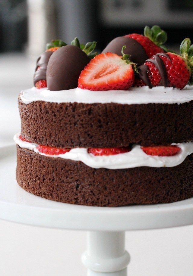 a chocolate cake with strawberries on top