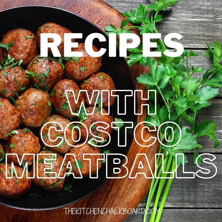 some meatballs are in a bowl with parsley on the side and green herbs