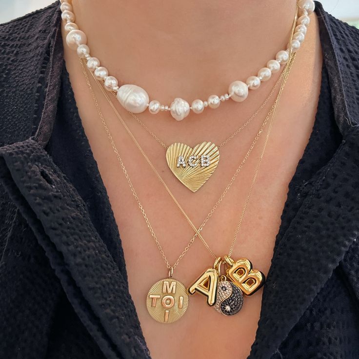 A new charm has arrived and I am living on a cloud with the endless layering options with this adorable beauty. These initials appear to be full of helium and are oh so fun! Mixing and matching are a must because charms love friends. Available in 14k yellow gold Height measures approximately 2/3" Charm depth measures approximately 1/5" 1mm singapore foxtail chain available By Ariel Gordon Jewelry Three Characters, Starburst Pendant, Yin Yang Charm, Initial Heart Necklace, Classic Pearl Necklace, Special Necklace, Jimmy Choo Heels, Initial Pendant Necklace, Chanel Purse