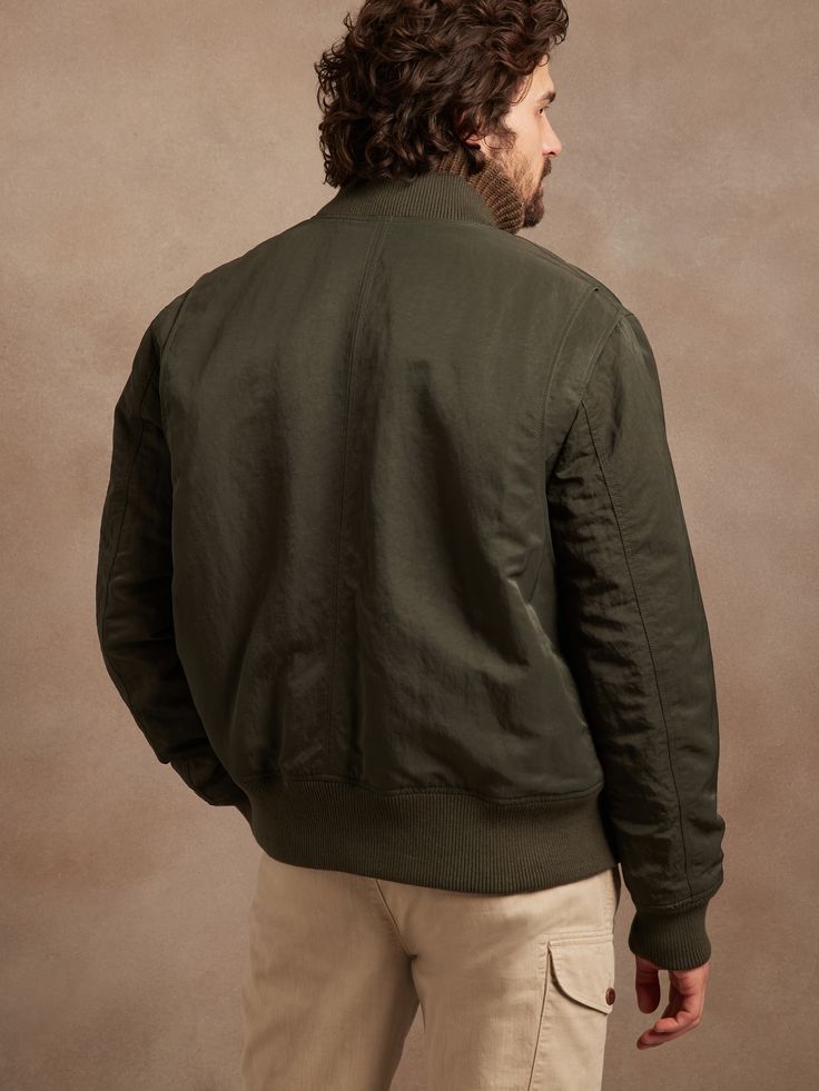 A closet classic, this slightly relaxed water-repellent bomber offers an soft, knit collar and dual entry pockets for style that is at once modern and nostalgic.  Beautiful crinkle nylon adds texture and warmth through the colder months.  WARMER: Ful Dark Olive Green, Knit Collar, Repellent, Water Repellent, Olive Green, Banana Republic, Long Sleeve Tshirt Men, Bomber Jacket, Men Sweater