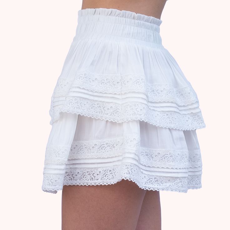 The skirt that will have you twirling through life with style. Absolute Cuteness is the must-have for the it girl who loves to play with her fashion choices. The lace trim adds a touch of flirtiness and youthful fun to a more mature style. Pair with a crop top and favorite shoe for a summer look that will turn heads. Chic Lace Mini Skirt, Chic Mini Skirt With Lace Trim, Chic Lace Mini Skirt With Lined Skirt, Chic Lace Mini Skirt With Lining, Chic Lined Lace Mini Skirt, Chic Lace Trim Mini Skirt, Chic Lace Lined Mini Skirt, Chic Lace Skirt, Chic Flowy Mini Skirt With Lace Trim