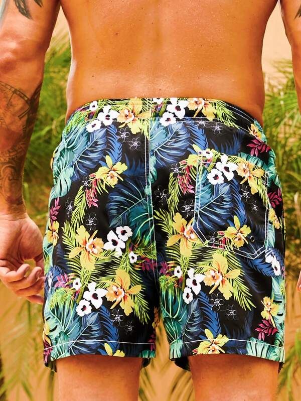 Get ready to embrace the tropical paradise with our Flower Tropical Print Swim Trunks. These swim trunks feature a vibrant and captivating floral print that instantly transports you to a beach getaway. The drawstring waist ensures a comfortable and adjustable fit, allowing you to enjoy your time in the water with ease. Specifications: Pattern Type: Tropical, All Over Print Details: Drawstring, Pocket Type: Bottoms Bottom Type: Shorts Fabric: Non-Stretch Composition: 100% Polyester Care Instructi Multicolor Hawaiian Summer Bottoms, Multicolor Hawaiian Shorts For Beach Season, Tropical Short Swim Trunks For Beach, Tropical Style Short Swim Trunks For Beach, Tropical Swim Trunks For Vacation, Tropical Style Short Swim Trunks, Hawaiian Swim Trunks For Vacation, Hawaiian Short Swimwear For Beach Season, Hawaiian Style Swim Shorts