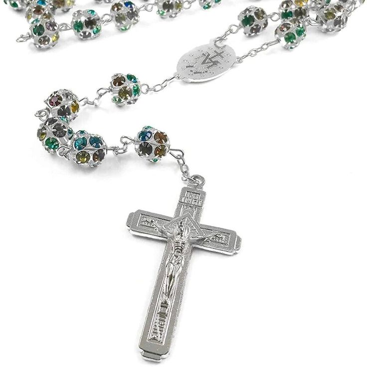 - Features vibrant crystal beads for a beautiful and eye-catching design.- Handcrafted with care and authenticity from the sacred land of Jerusalem.- Represents a symbol of faith and devotion for Catholics.- Makes a special and meaningful gift for religious occasions or personal wear.- Experience the spiritual connection with this exquisite rosary necklace.- Order now to own a piece of the Holy Land and embrace your faith.- Measures 44cm (17") in length with a 5cm x 3cm (2" x 1.2") Cross.- Embra Catholic Necklace, Rosary Necklace, Holy Land, Silver Coat, Rosary Catholic, Rosary Beads, Rosary, Meaningful Gifts, Crystal Beads