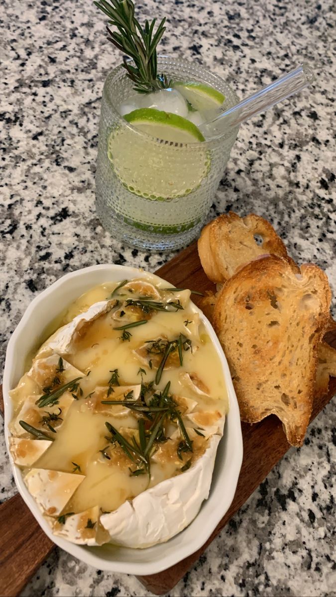 a bowl of cheese and bread on a table