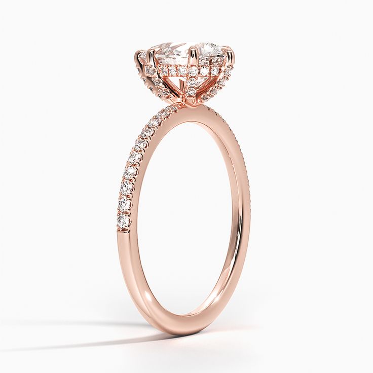 Pear Shaped Viviana Half-Coverage Diamond Engagement Ring - 14K Rose Gold. This classic engagement ring features shimmering scalloped pavé diamonds that extend half of the way around the ring. A diamond adorned gallery and graceful claw prongs embrace the center gem (1/4 total carat weight). 
 
 Our perfect fit engagement rings are carefully designed to sit flush against a variety of wedding rings for a seamless look with no gaps. Classic Oval Diamond Ring With Pave Setting, Luxury Rose Gold Cluster Ring For Weddings, Classic Halo Ring With Pave Setting For Promise, Luxury 14k Rose Gold Halo Setting Rings, Classic Rose Gold Diamond Ring With Pave Setting, Luxury 14k Rose Gold Rings With Halo Setting, Classic Cushion Cut Ring With Pave Setting, Rose Gold Diamond Cluster Ring For Wedding, Elegant Halo Ring For Proposal With Round Cut