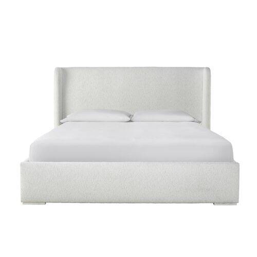 a bed with white linens and pillows on it's headboard, against a white background