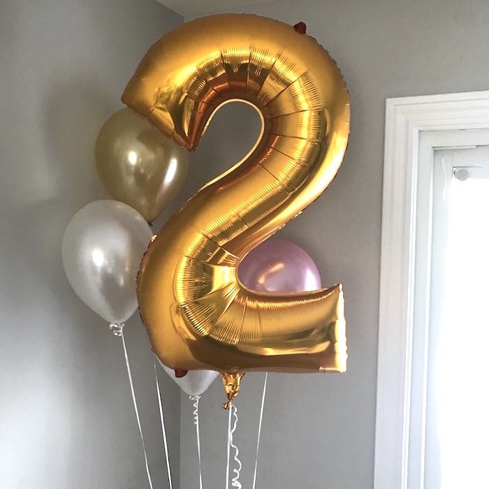 the number two balloon is gold and silver