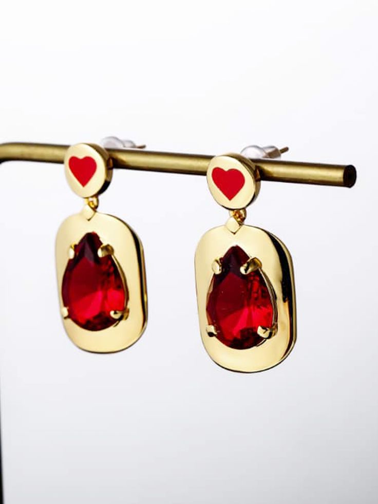 These enamel heart earrings with glass stone will add a simplistic yet classy touch to any style. Handmade in a classic shape, it is elegant whether dressed up or down. by skilled artisans in India, each piece radiates craftswomanship and effortlessly cool style. DETAILS Approx. 1.2"H x .58"W 18K Gold-plated brass Glass stone Hard enamel Steel posts 100% lead & nickel free Imported Photo: Aggy-wide-GRjA0oZDosE-Unsplash Elegant Enamel Heart Cut Jewelry, Elegant Heart Cut Enamel Jewelry, Enamel Drop Earrings For Party, Elegant Enamel Earrings For Party, Elegant Enamel Party Earrings, Valentine's Day Enamel Dangle Earrings, Enamel Earrings With Heart Charm As Gift, Enamel Heart Charm Earrings As Gift, Elegant Heart-shaped Enamel Earrings