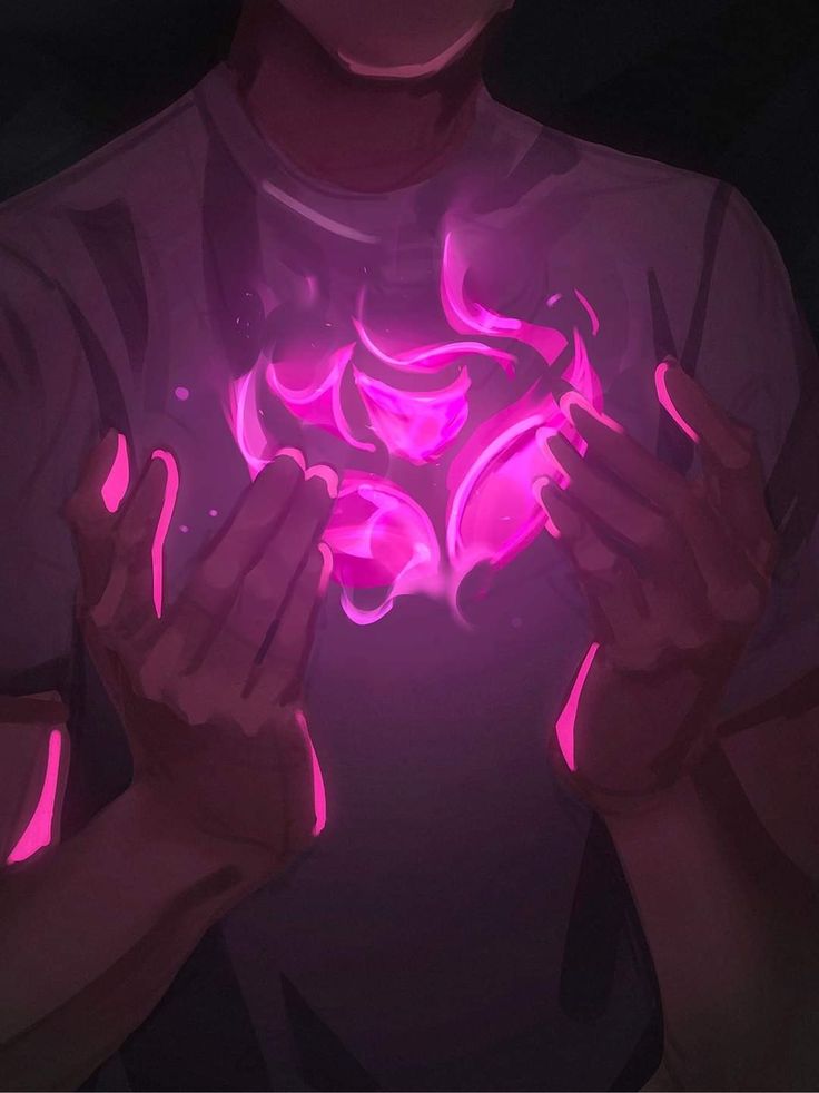 a person holding their hands in front of her chest with glowing pink lights on it