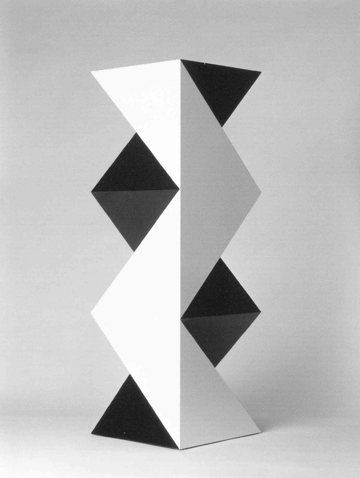 a black and white photo of an abstract object in the shape of a cube with three smaller squares on each side