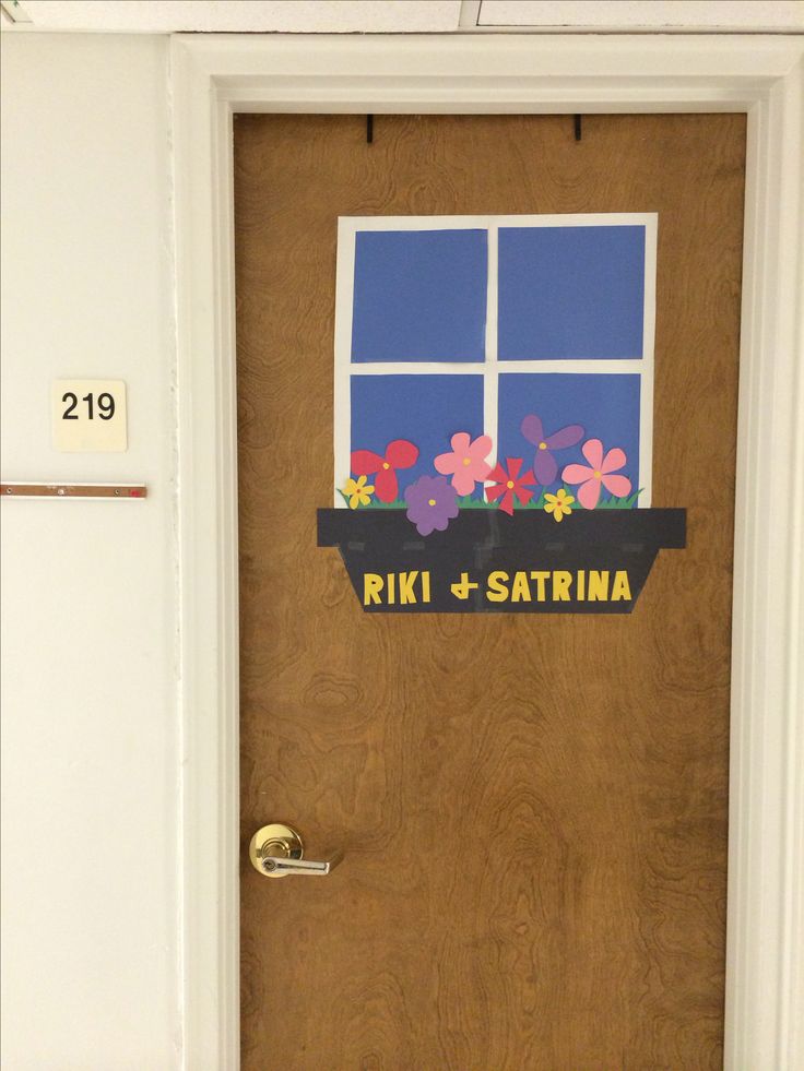 a door decorated with flowers and the words riki & sattrina on it