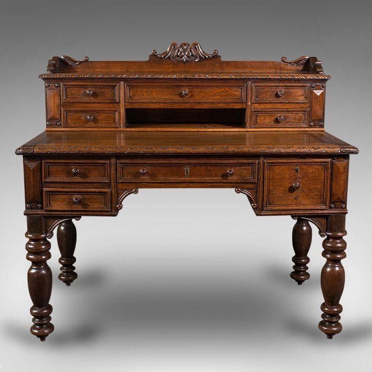 an old wooden desk with drawers on it