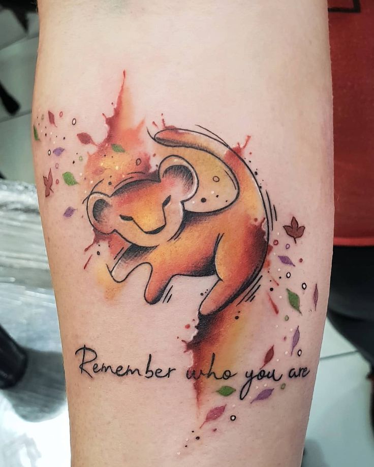 a lion tattoo with the words remember who you are