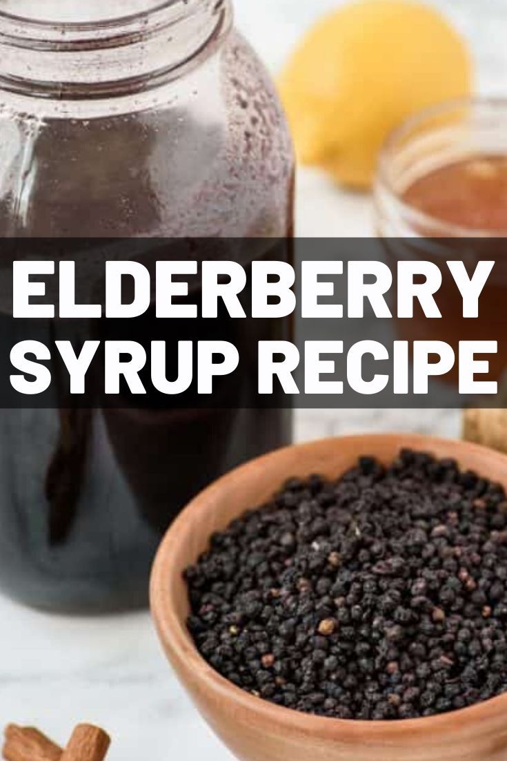 elderberry syrup recipe in a wooden bowl next to cinnamons and an orange slice