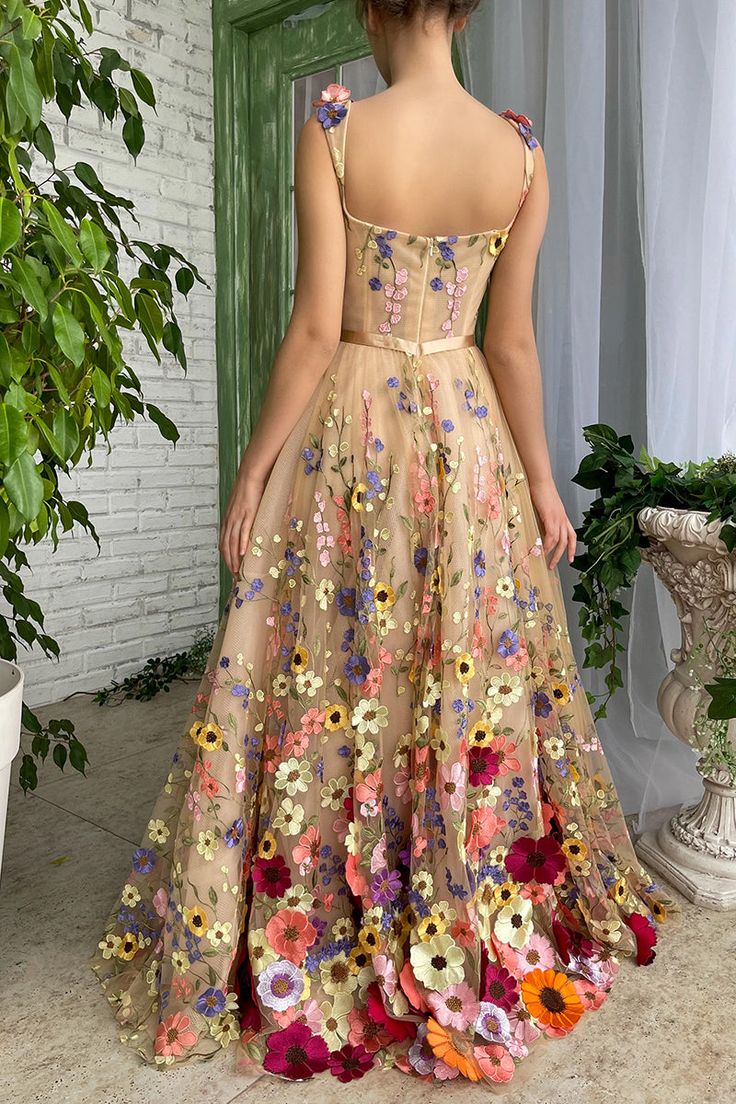 The Royal Bloom Embroidered Maxi Dress has a bouquet's worth of beauty in one gorgeous dress! Mesh fabric (with a champagne poly-liner) boasts a lush pattern of multicolored, embroidered flowers as it shapes this darling dress. It features queen-anne neckline, corset with built-in pads and boning. Cinched waist with decorative bow ribbon belt tops A-line maxi skirt that has inseam side pockets. Hidden zipper/clasp at back. Handmade-To-Order. Tulle, Polyester. Lined. Runs true to size. Hand Wash