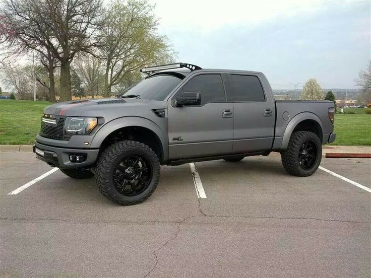 a large gray truck parked in a parking lot