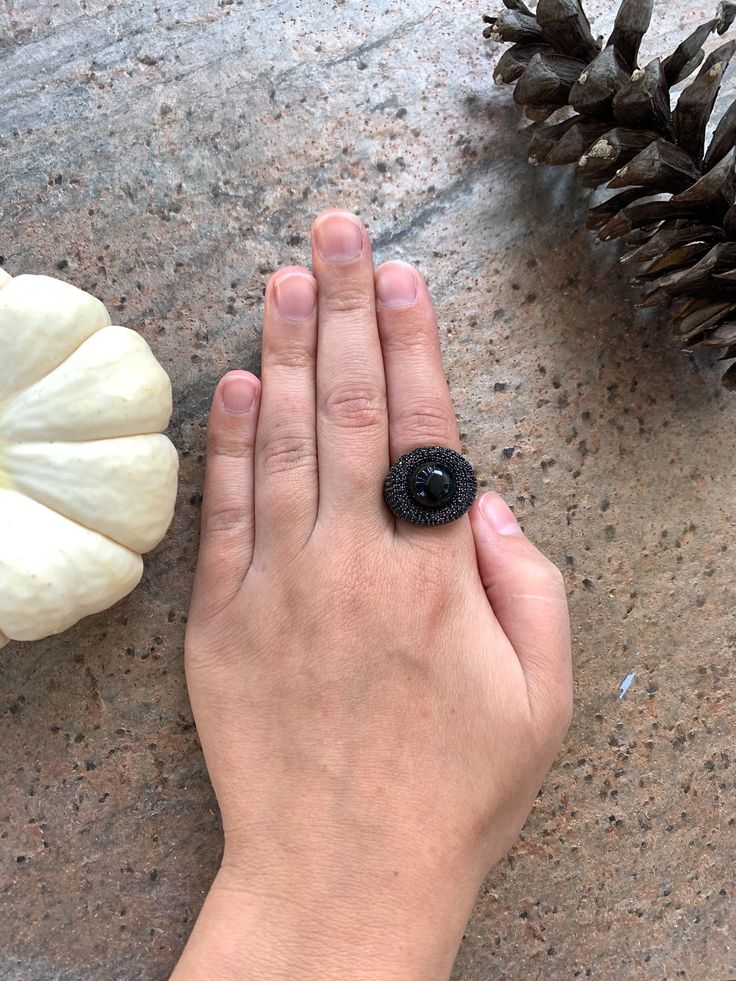 "14k Yellow Gold Sterling Silver Black Onyx Orb Pave Black Spinel Nest Ring Size 6.5 up for offer is a stunning 14k yellow gold over solid sterling silver black onyx orb set in a nest of pave black spinel ring. This ring is marked \"925\". Measurements Ring Size: 6.5 Band Width: 4mm Black Onyx Orb: 13mm Black Spinel: 1.3mm Weight: 9.5 g Materials -14k Yellow Gold -Sterling Silver -Black Onyx -Black Spinel Condition: New; Please look closely at the pictures provided as they are an extension of th Black Oval Cluster Ring For Anniversary, Black Round Sapphire Ring For Anniversary, Black Spinel Sapphire Ring Gift, Black Sapphire Gemstone Ring For Anniversary, Black Gemstone Rings For Jewelry Making, Black Gemstone Ring For Anniversary, Black Crystal Ring With Gemstone For Gift, Black Crystal Gemstone Ring For Gift, Black Oval Ring With Black Diamonds