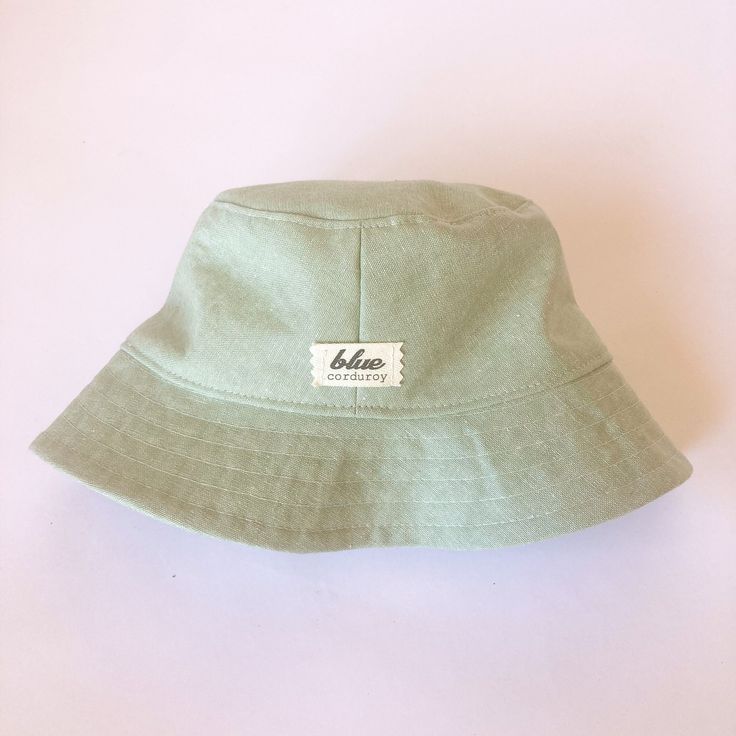 The perfect linen bucket hat! Made from a mint green linen blend fabric. This hat is very comfortable to wear. A great sun hat for women or men. I made this hat with a day of adventure in mind, somewhere sunny and wild! For baby or kid version of this hat, see link below. This hat is made from a mint green linen and cotton blend fabric. Inside liner is white cotton. Interfacing inside brim for extra shape. Brim measures approx. 2.5" wide. Crown measures approx. 3.5" deep. **Hat on models in diff Trendy Green Cotton Sun Hat, Green Travel Hat For Spring, Trendy Green Sun Hat With Curved Brim, Green Spring Travel Hat, Lightweight Cotton Summer Bucket Hat, Green Wide Brim Cotton Sun Hat, Summer Cotton Hat For Everyday, Summer Lightweight Cotton Bucket Hat, Cotton Summer Hat For Everyday Wear