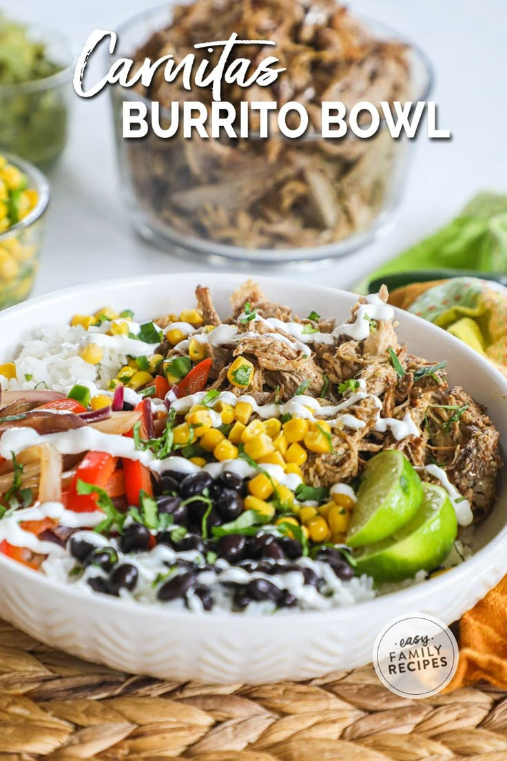 a white bowl filled with mexican food on top of a table