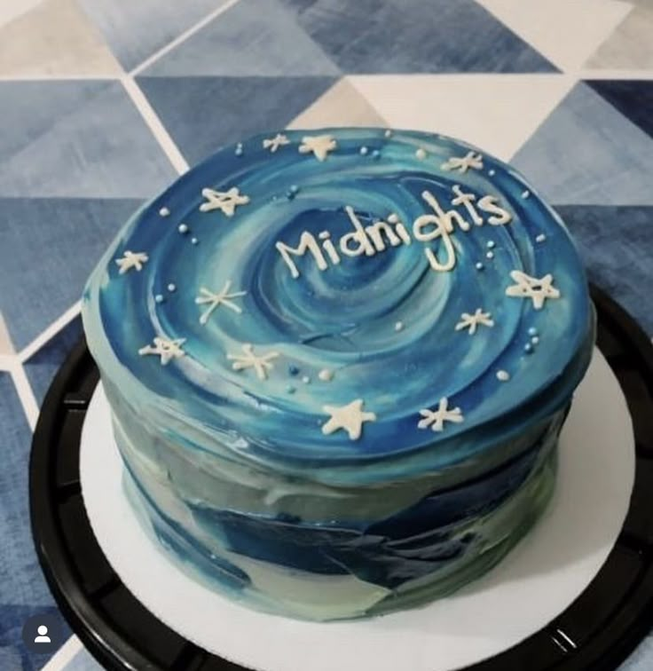 there is a cake that has the words midnights written in frosting on it