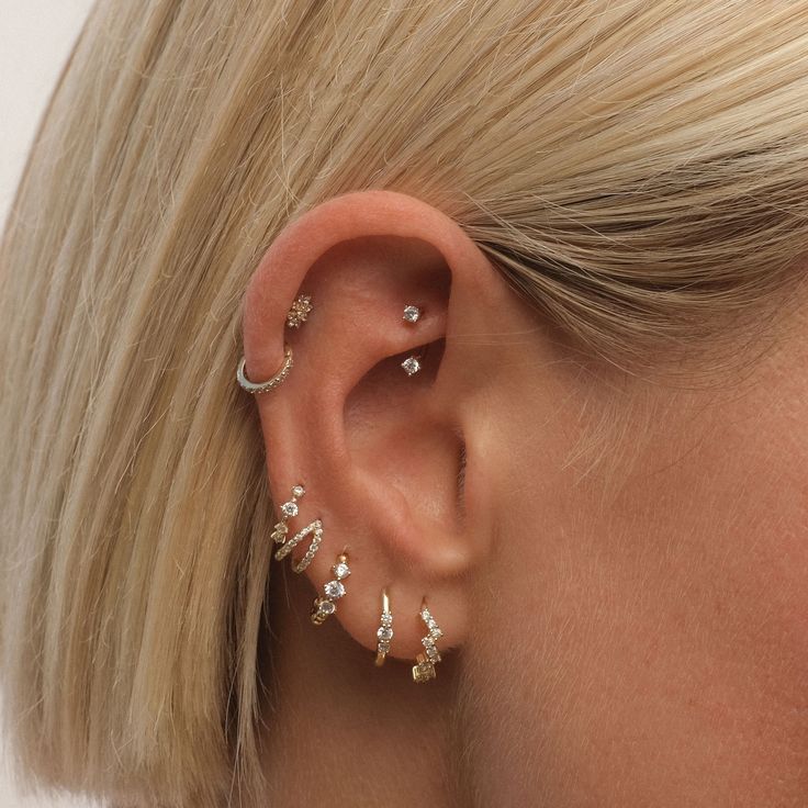 For the girl who sets her own style rules: Meet the Tate earring set. With its six-piece collection of all-asymmetrical pieces, you’re free to create a look that’s uniquely yours. Forget left and right—mix and match to your heart’s content and embrace your own fashion freedom. Created with a sterling silver base and utilizing luxury 14 karat gold plating, this Adorn Luxe hoop earring set can be enjoyed season after season.