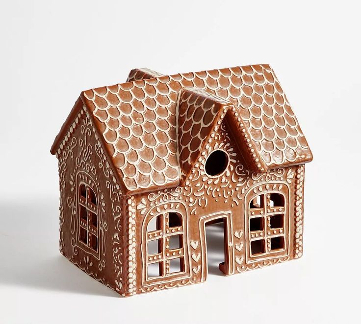 a gingerbread house is shown on a white background