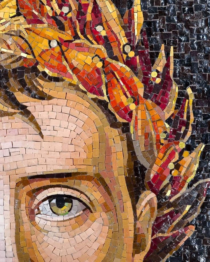 a mosaic portrait of a young man with leaves on his head and the eyes are wide open