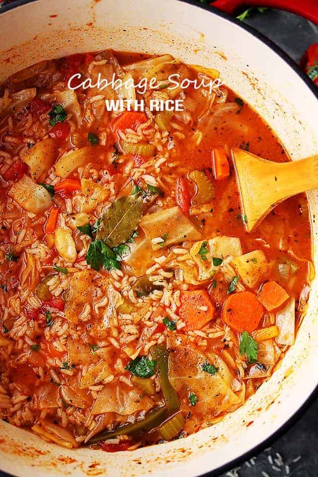 cabbage soup with rice and vegetables in a pot