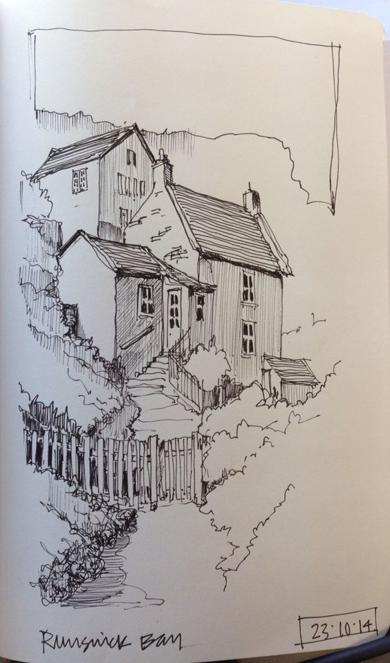 an open book with a drawing of a house