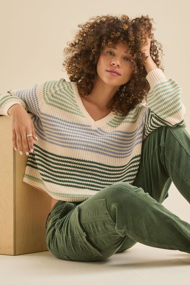 Stay effortlessly stylish with our multi-colored striped sweater. Featuring a flattering V-neck design, it's the perfect blend of comfort and chic, whether you're lounging seaside or heading out for a night under the stars. Striped Knit V-neck Sweater, Trending Sweaters, A Night Under The Stars, Night Under The Stars, Gay Fashion, Pattern Sweater, Green Pattern, Altar'd State, Under The Stars