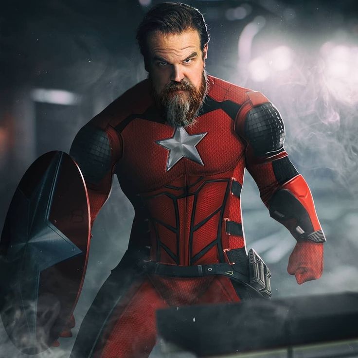 a man in a red suit with a beard and star on his chest holding a shield