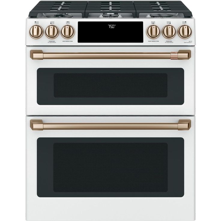 two white and gold ovens side by side with the top one showing its burners