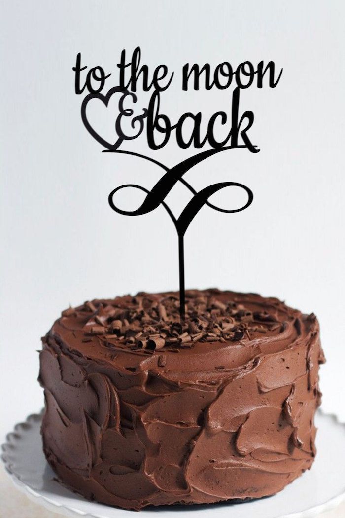 a chocolate cake with the word seventy on it