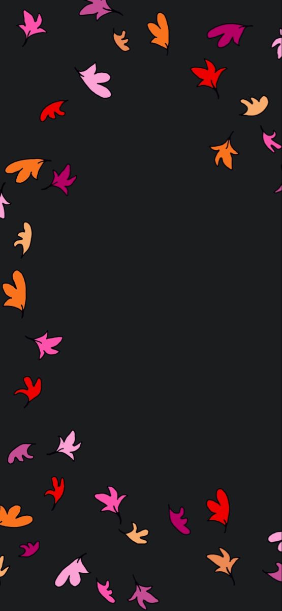 colorful leaves flying in the air on a black background