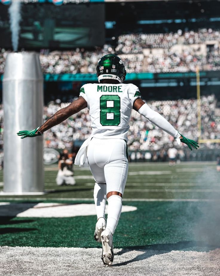 a football player is running on the field