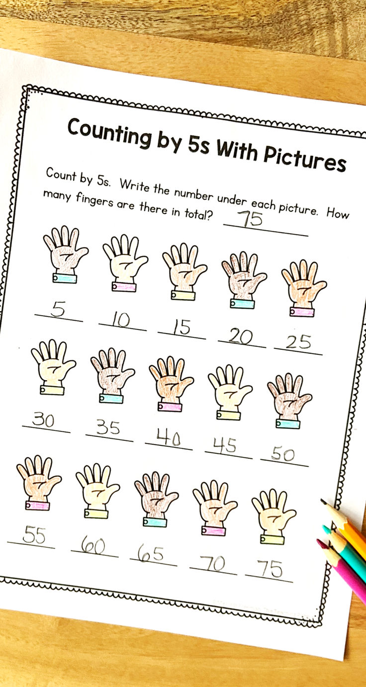 counting by 5s with pictures worksheet and pencils on a wooden table