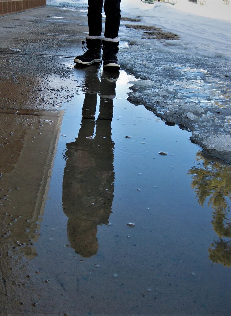 a person standing in the middle of an icy street