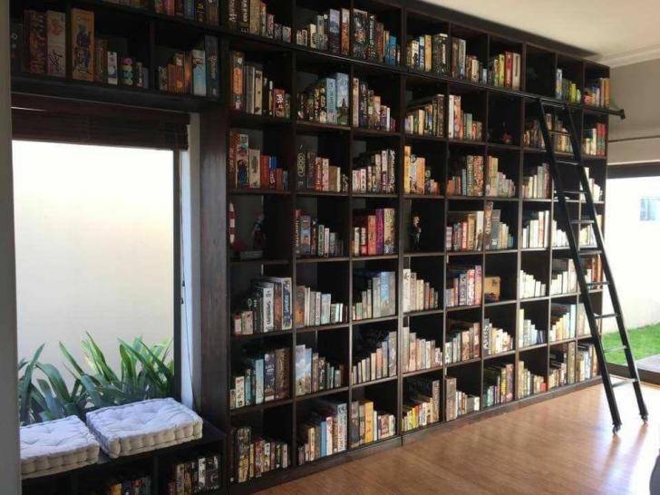 a ladder leaning up against a book shelf filled with books