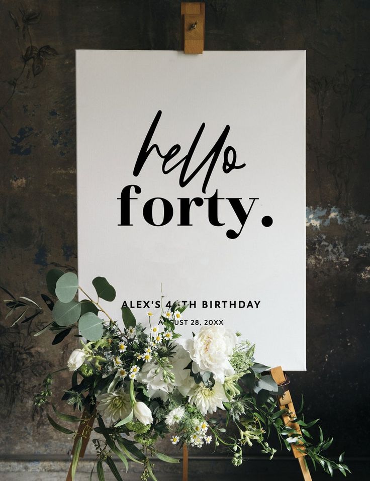 a sign that says hello forty next to some flowers and greenery on a easel