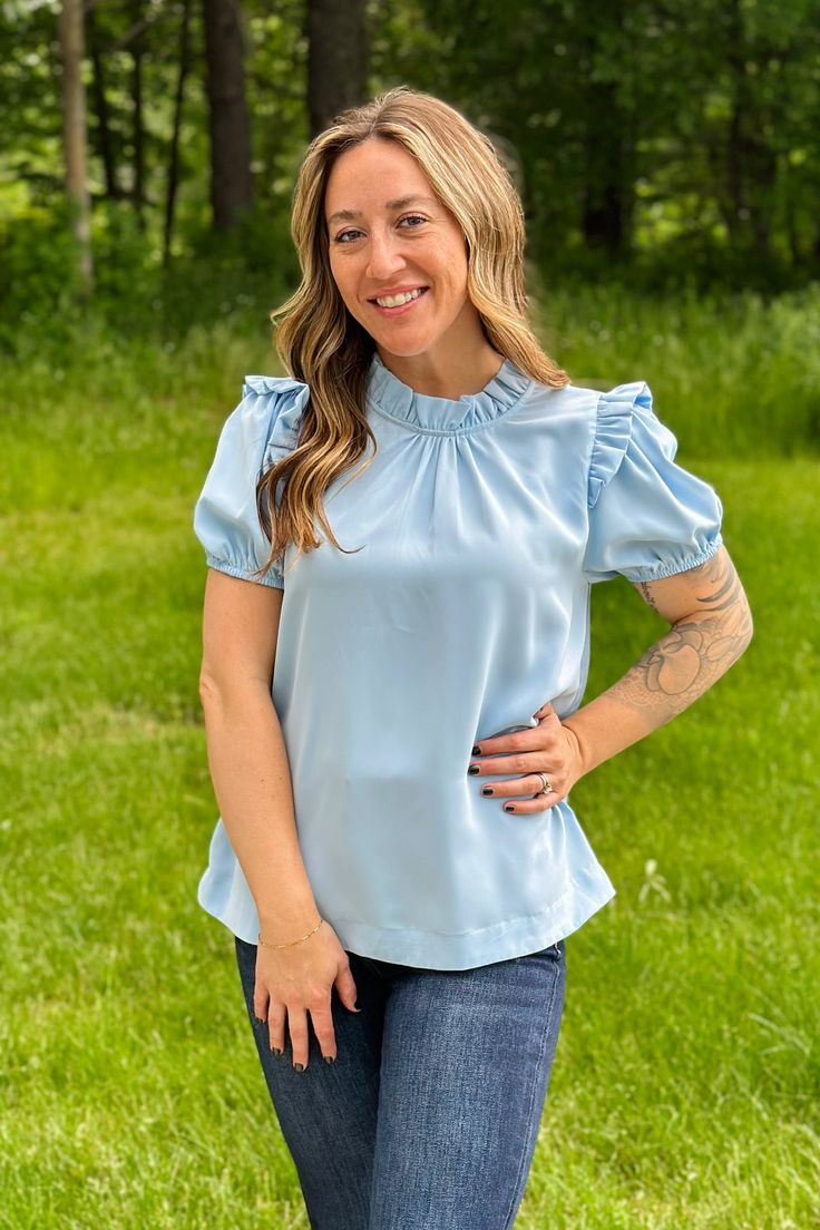 This Peasant Sleeve Blouse is the perfect combination of fashion and function. Featuring a solid top with a frilled neck, ruched bodice, back key hole, and short peasant sleeves, this blouse is crafted from unlined, lightweight, and non-sheer fabric. This stylish and comfortable blouse is ideal for warm days. Fit: True to size; Mod wearing size Small Comfortable Blouses, Peasant Sleeve, Ruched Bodice, Sheer Fabric, Key Hole, Solid Tops, Sheer Fabrics, Apparel Accessories, Bodice