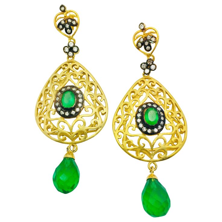 The handmade filigree faux emerald green earrings is ornate and lovely, it is further enhanced by sparkling CZ stones. Earrings have a post closure for pierced ears. Length: 2 3/4 inches Width: 1 1/2 inches Elegant Green Chandelier Earrings With Intricate Design, Green Intricate Design Dangle Earrings, Green Dangle Earrings With Intricate Design, Elegant Green Earrings With Intricate Design, Luxury Green Teardrop Earrings, Exquisite Green Teardrop Earrings, Green Chandelier Earrings With Intricate Design For Festive Occasions, Victorian Green Earrings For Wedding, Green Handmade Earrings For Evening