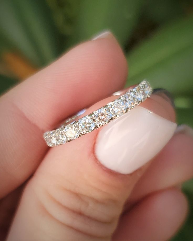 This classic wedding band features a half band of pave set diamonds. Details: Size: US 7 ( can be sized ) Weight: 4.4 grams Primary stone: Diamond ( Appx. 0.80 tcw. ) Shape: Round Clarity: VS Color: H Metal: Platinum Style: Pave Half Eternity Condition: Brand new Inside of band is stamped and tested for 'Platinum' gold. All pieces are polished and refinished in our shop. SIZING: Currently this ring is a size 7 but could be sized up or down for an additional small fee if desired by adding custom Luxury Half Eternity Diamond Ring With Round Band, Luxury Half Eternity Bands, Wedding Eternity Band With Pave Setting, Cubic Zirconia Eternity Band With Pave Setting For Wedding, Eternity Band With Pave Setting For Promise Ring, Brilliant Cut Eternity Band For Promise, Brilliant Round Cut Eternity Band For Promise, Pave Setting Eternity Band As Promise Ring, Classic Moissanite Eternity Band For Promise