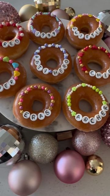 there are six donuts decorated with words on them