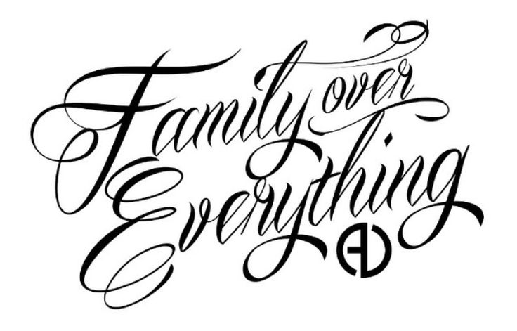 the words family over everything are written in black ink