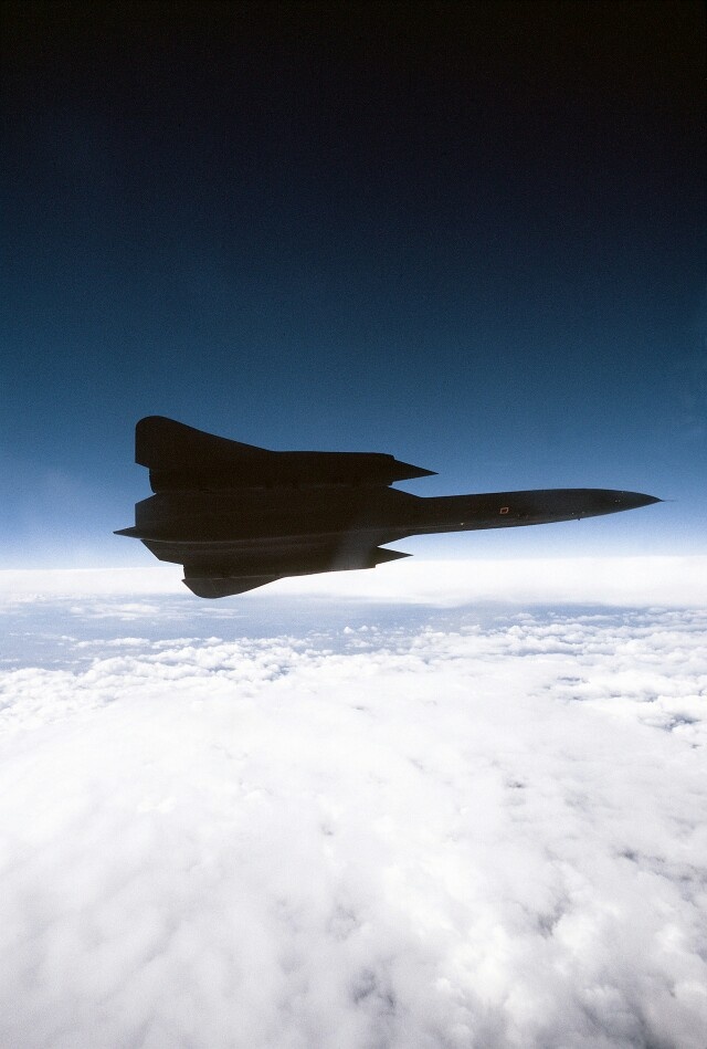 an airplane is flying high above the clouds