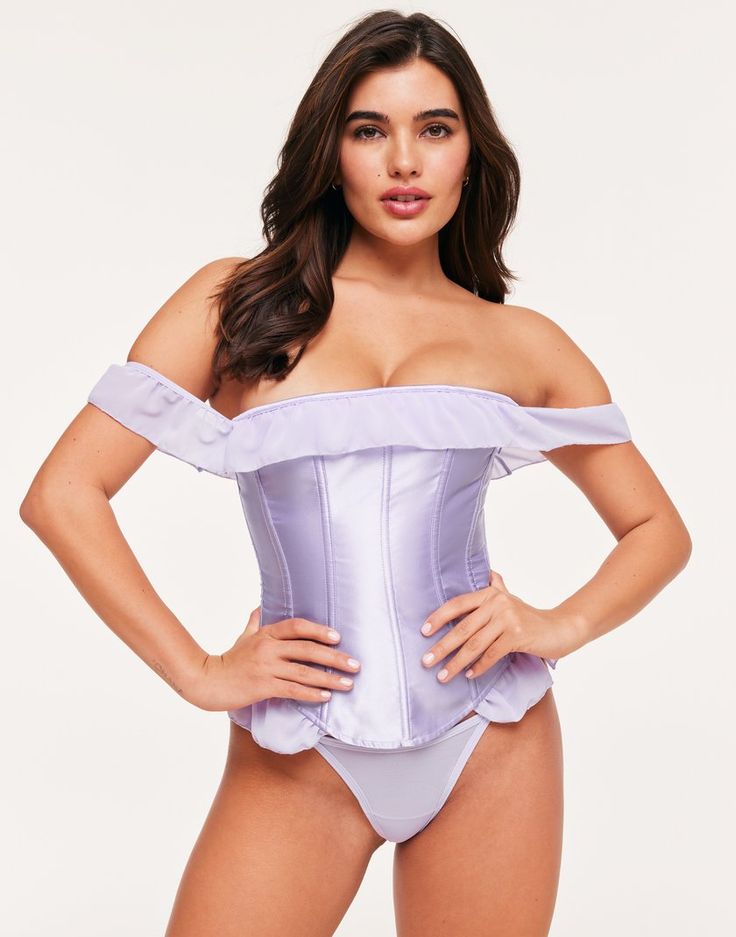 The Beau corset top is an elegant choice for a romantic evening. This gorgeous corset is crafted with sustainable materials and features an off-the-shoulder ruffle strap and a lace-up back. Wear with the matching G-string panty for a complete set. (Available in sizes XS-XL.) Fitted Strapless Off-shoulder Top For Party, Evening Strapless Corset With Ruffles, Fitted Strapless Off-shoulder Top For Evening, Glamorous Fitted Off-shoulder Tube Top, Glamorous Off-shoulder Fitted Tube Top, Flirty Ruffled Corset With Sweetheart Neckline, Flirty Sweetheart Neckline Corset With Ruffles, Fitted Off-shoulder Corset Dress With Ruffles, Spring Off-shoulder Fitted Corset